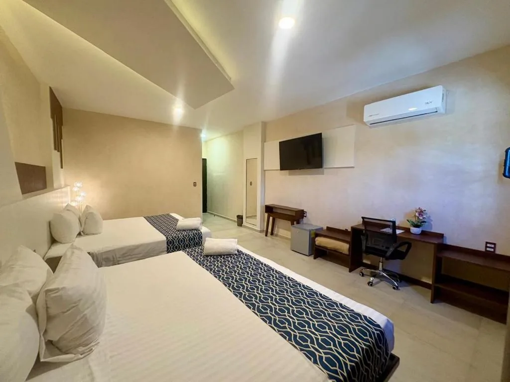 Spacious guest room at Hotel Taxaha